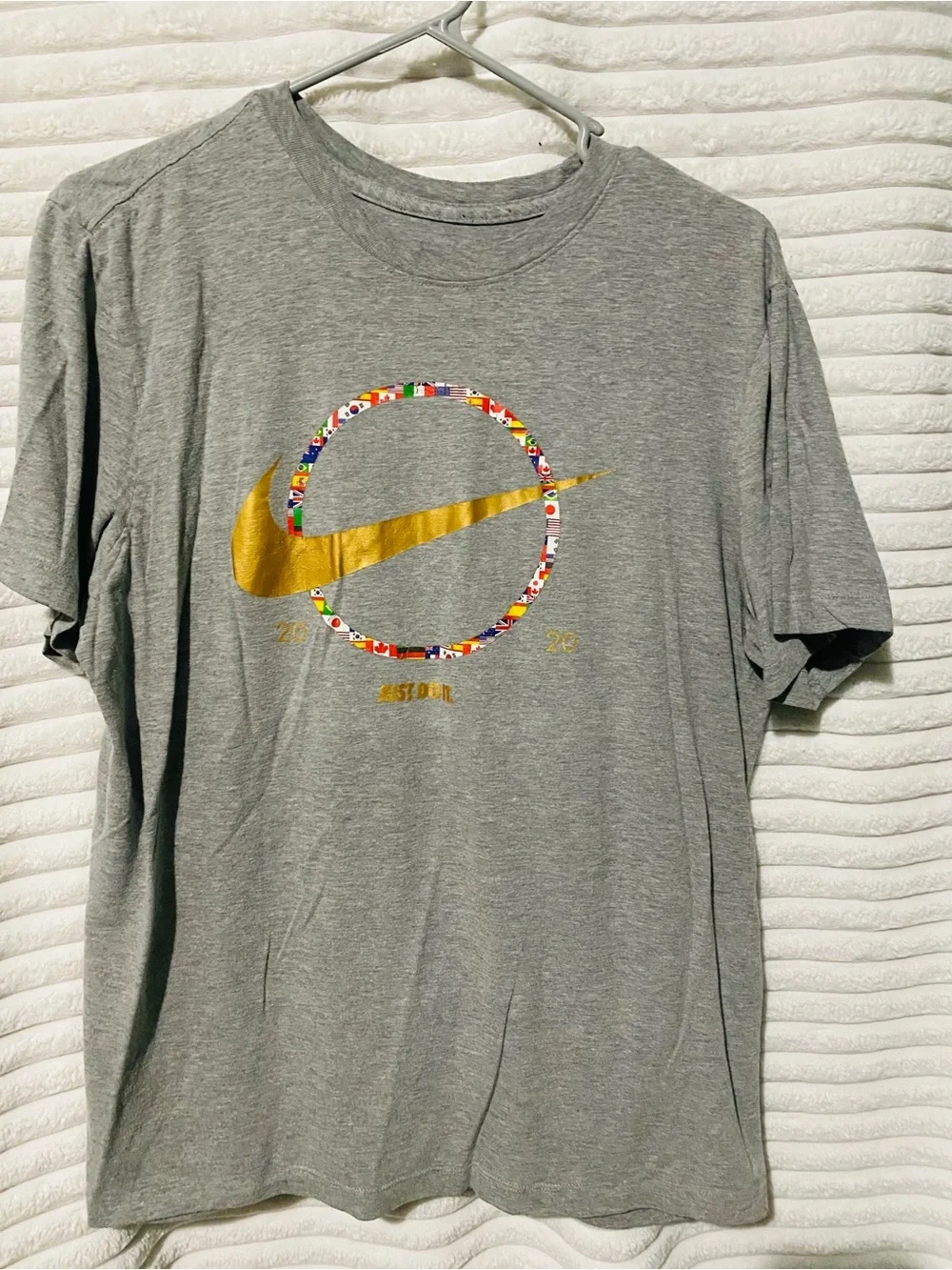 Nike Gray Short-Sleeve Tee with Gold Swoosh and Multicolor Flag Ring